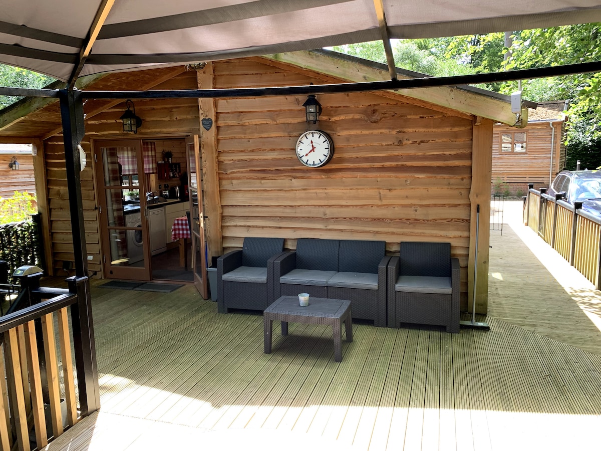 Deck with rattan sofa set, coffee table and gazebo canopy