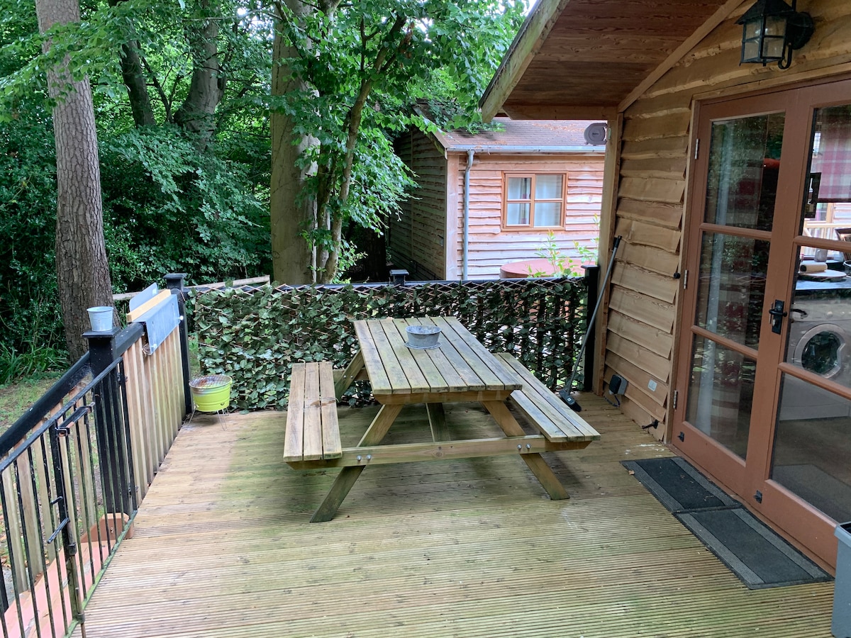 Deck with picnic table and French doors into the cabin